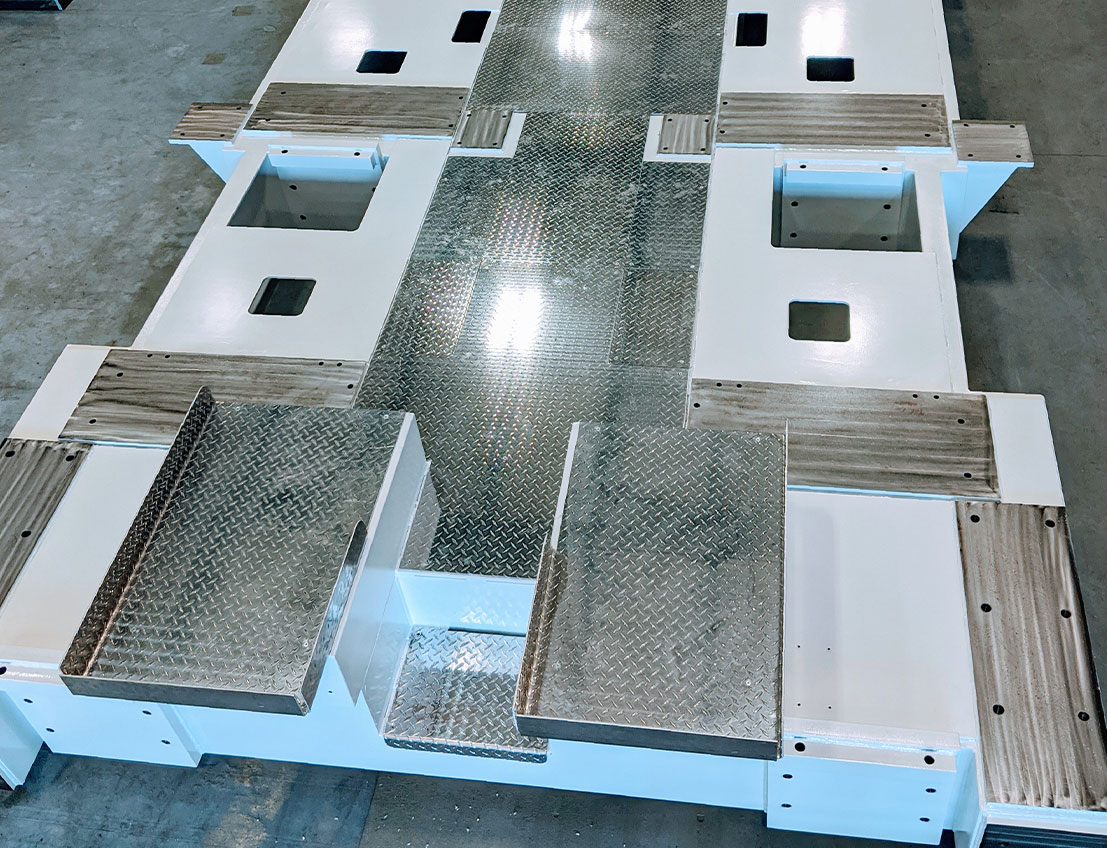 carbon steel machinery base shown with diamond plate steel, white painting, pre drilled