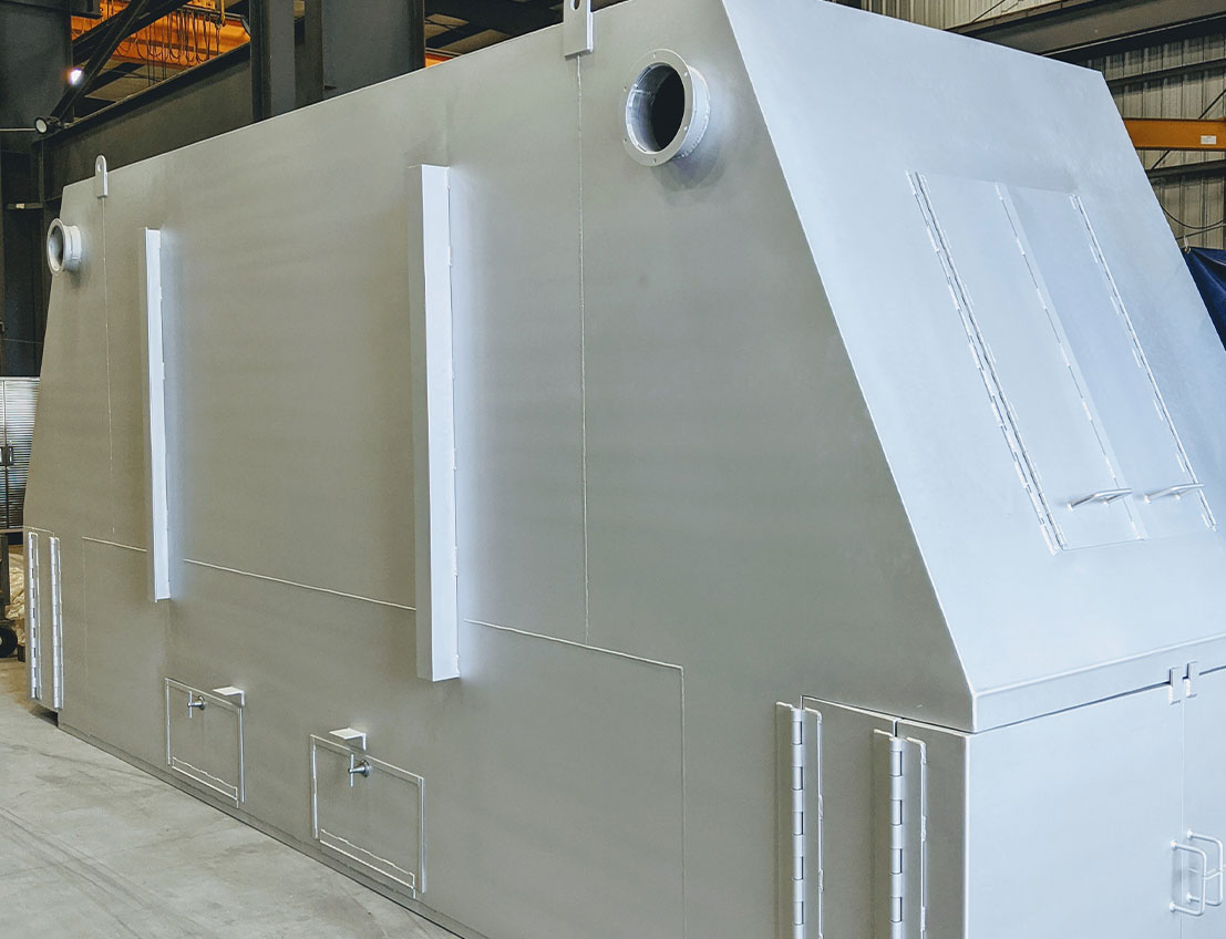 Durable carbon steel melter enclosure finished with high-temperature silver paint