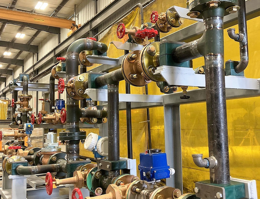 Custom carbon steel piping skid showing excellent metal work, valves, and guages.