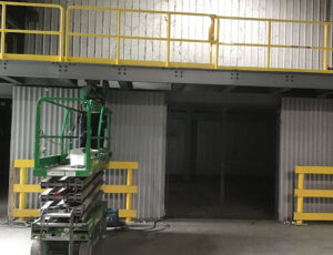 Platform being installed showing railings and underside of mezzanine height