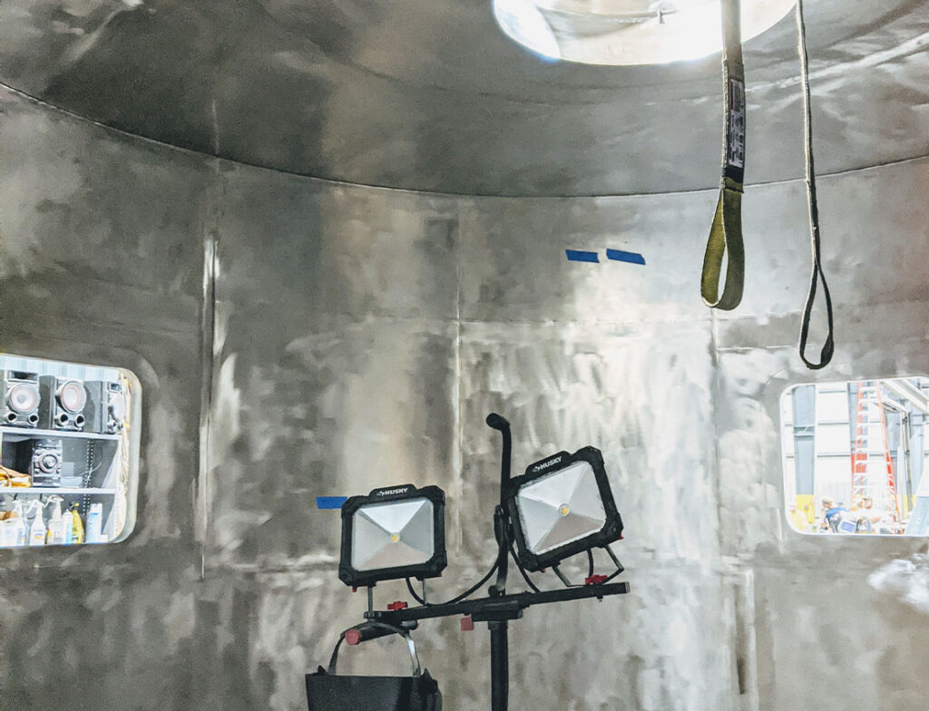 Custom spray dryer interior with uniform 2B finish shown with lights and strapping