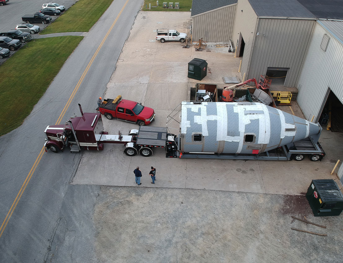 Spray Dryer boasting a size of 10 feet in diameter and 30 feet in length on a semitruck being loaded