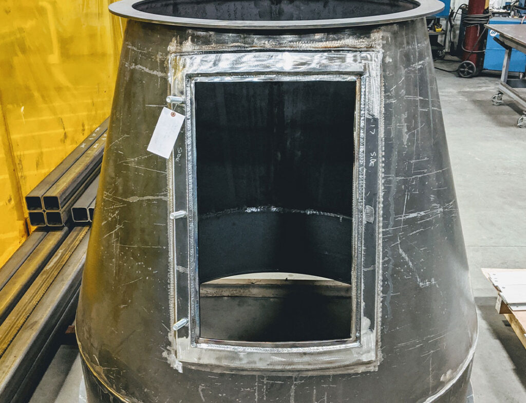 Custom high-performance carbon steel cylinders in progress showing metalwork