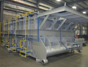 Industrial Furnace under construction shown with yellow piping and silver paint
