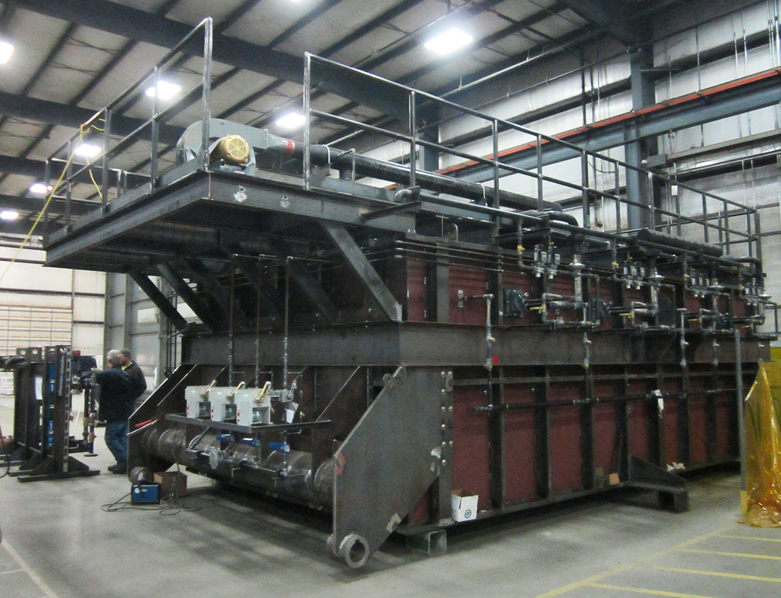 Turnkey Industrial Furnace for a foundry for the production of ingots and high-grade metal. This industrial furnace included piping, and heavy gauge plate, and is used to produce molten metal.