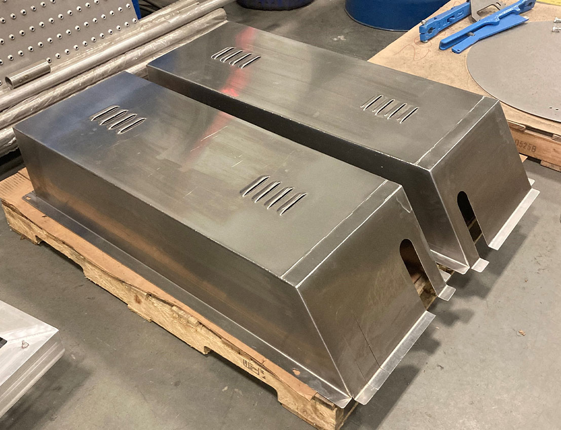 stainless steel, sheet metal hvac gaurding stacked upside down and ready for shipment