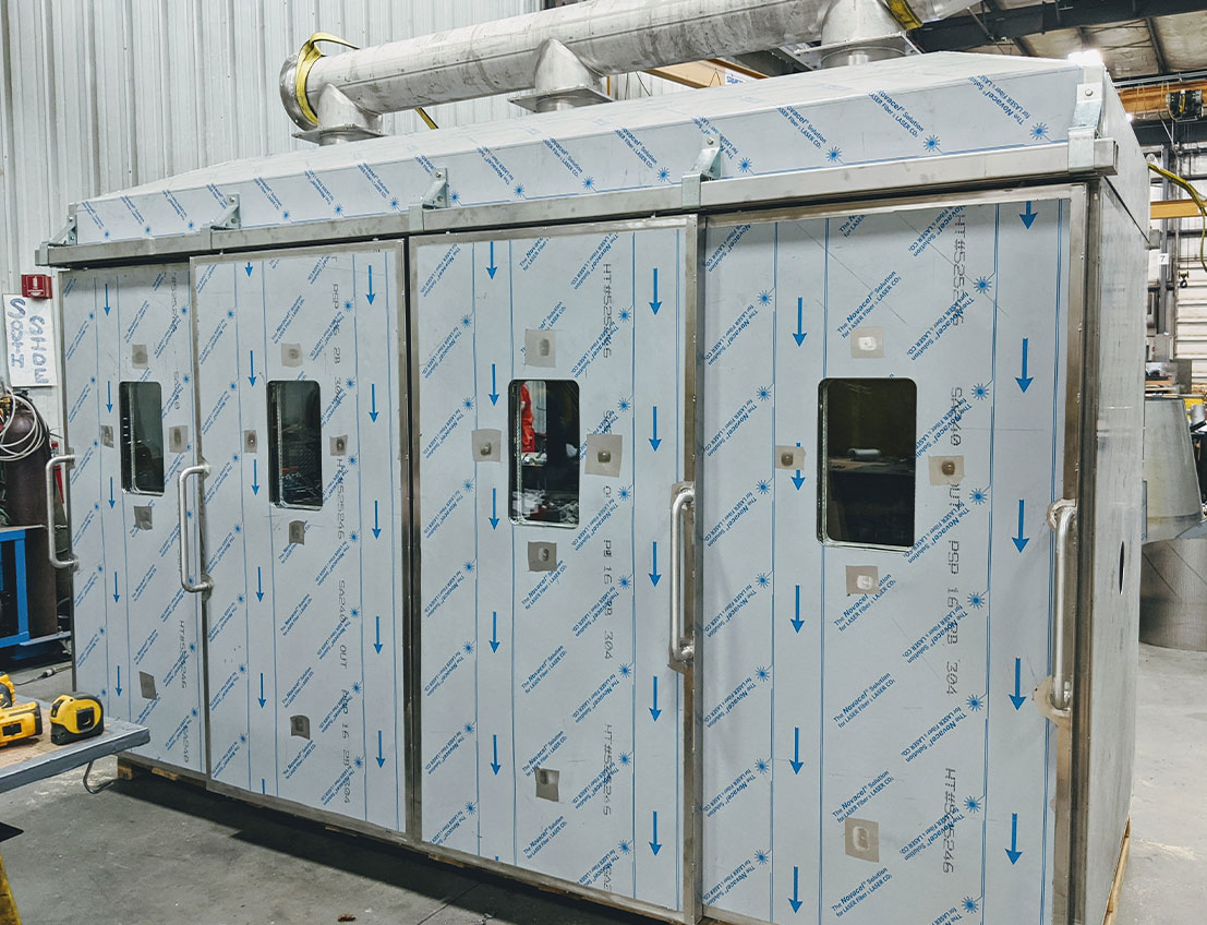 angled front view of Stainless Steel Industrial Oven wrapped in protective film for shipment and installation