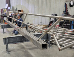 expertly welded custom stainless steel hand railings shown in progress at SWF