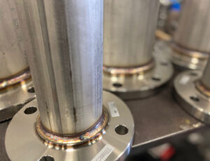 Stainless steel pipe welded to a pipe flange