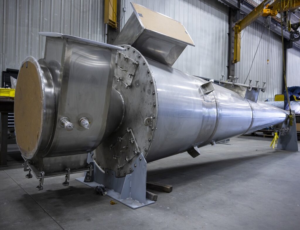 Custom stainless steel cyclone, perfectly prepared for fitting into an existing structure.