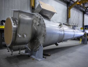 Custom stainless steel cyclone, perfectly prepared for fitting into an existing structure.